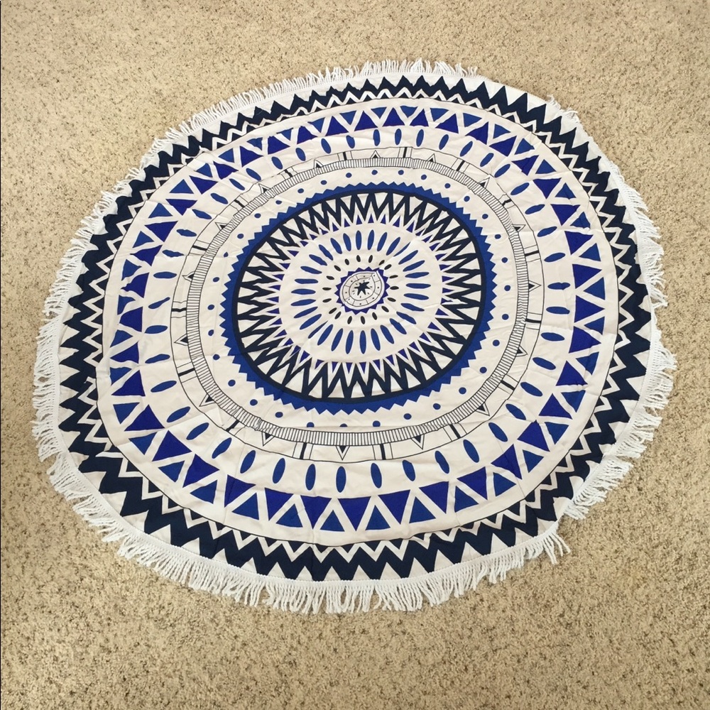 Tribal pattern fringed beach throw.